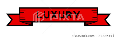Vintage red color ribbon banner with word luxury on white background Vintage red color ribbon banner with word luxury on white background 84286351
