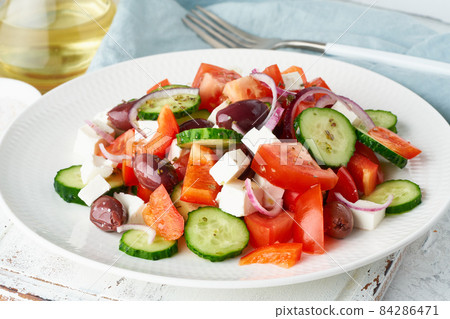 Greek village salad horiatiki with feta cheese, olives, cherry tomato, cucumber and red onion Greek village salad horiatiki with feta cheese, olives, cherry tomato, cucumber and red onion 84286471