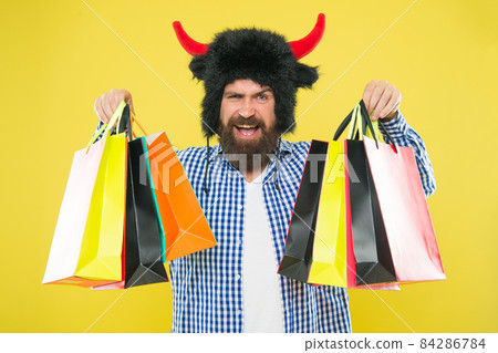 Wild about shopping. Man strict face wear hat of bull  84286784