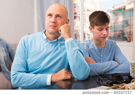 Man and his son offended at each other 84287157