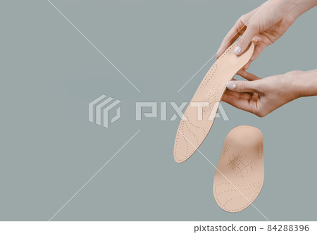 Orthopedic insole isolated on a white background. Medical insoles. Treatment and prevention of flat feet and foot diseases. Foot care, feet comfort. Wear comfortable shoes. Flat Feet Correction. 84288396