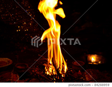 Beautiful view of the flames of the campfire in the darkness for havan pooja 84288959