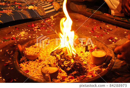 Beautiful view of the flames of the campfire in the darkness for havan pooja Beautiful view of the flames of the campfire in the darkness for havan pooja 84288973