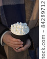 Bright white marshmallows atop cream and a fresh hot chocolate beverage 84289712