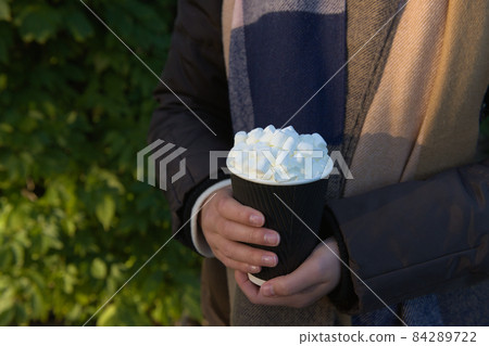 Takeaway hot beverage to go, in a disposable yet recyclable paper cup 84289722