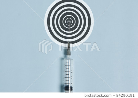 Syringe and aim on blue. High quality photo. 84290191