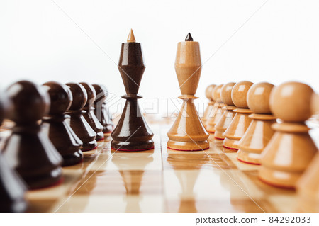 wooden chess pieces queens on the chessboard, close-up view wooden chess pieces queens on the chessboard, close-up view 84292033