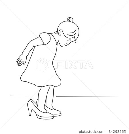Little girl in a dress is trying on her mother's shoes. Little girl in a dress is trying on her mother's shoes. 84292265