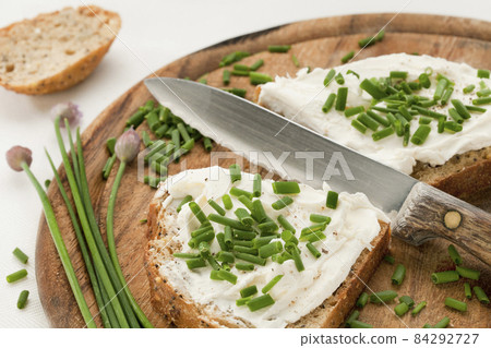 bread with cream cheese and chives 84292727