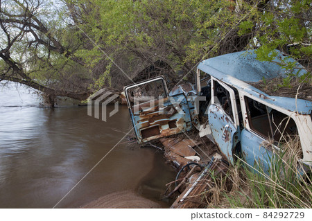 junk cars on river junk cars on river 84292729