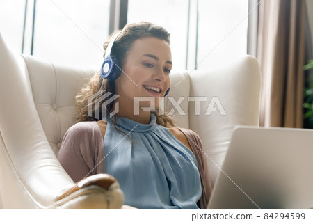 Happy young woman holding video call conversation. 84294599