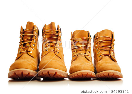 yellow winter boots isolated on white yellow winter boots isolated on white 84295541