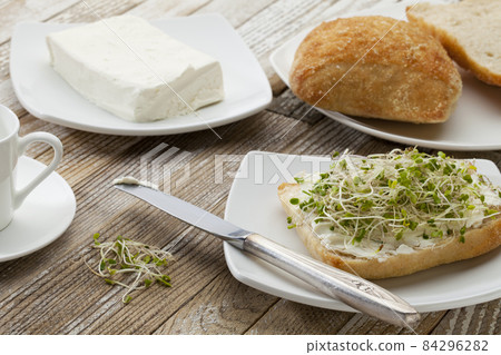 roll with cream cheese and sprouts roll with cream cheese and sprouts 84296282