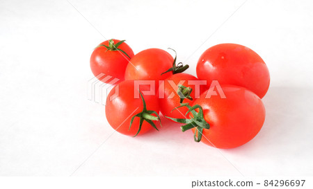 Petit tomatoes on a white background Petit tomatoes on a white background 84296697