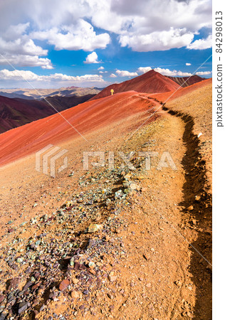 Hiking trail across the Red Valley at Vinicunca in Peru 84298013