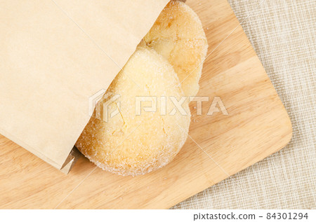 Homemade bread with cream and sugar on top. Homemade bread with cream and sugar on top. 84301294