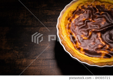 Parisian Flan, cutted classic tart served on a plate copy space 84303721