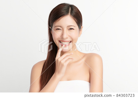 Beautiful young asian woman with clean fresh skin on white background, Face care, Facial treatment, 84303723