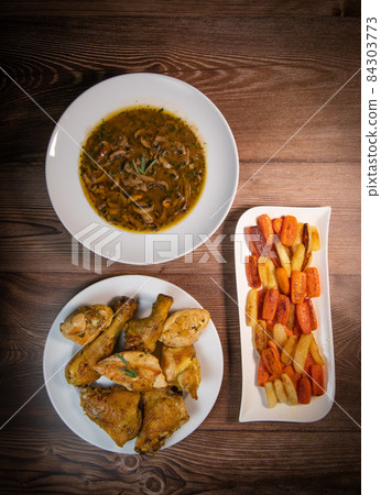 Chicken Hunter recipe with glazed root vegetables, carrot, turnip with its mushroom sauce deglazed 84303773