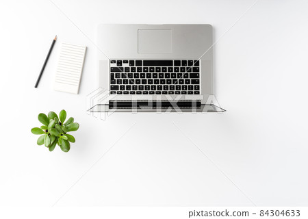 Business background with laptop and accessories on white table. Office desktop. Top view Business background with laptop and accessories on white table. Office desktop. Top view 84304633