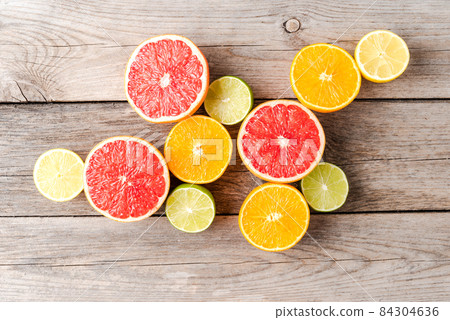 Juicy citruses on wooden table. Top view Juicy citruses on wooden table. Top view 84304636