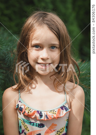 Portrait of a girl with lost milk teeth 84306176