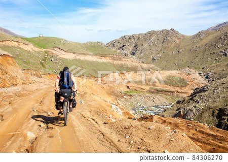 Traveling cyclist in Pontic Alps 84306270