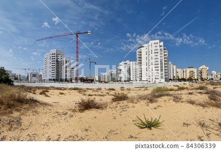 City construction among desert dunes. City construction among desert dunes. 84306339