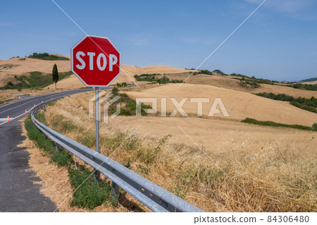 Stop road sign on hill of Tuscany Italy Stop road sign on hill of Tuscany Italy 84306480