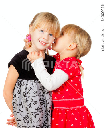 Little girls sharing a secret Little girls sharing a secret 84306616