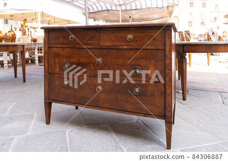 Chest drawer on flea market in Italy 84306887