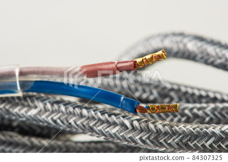 Close-up of fabric braided cable used in electrical wiring installation  84307325