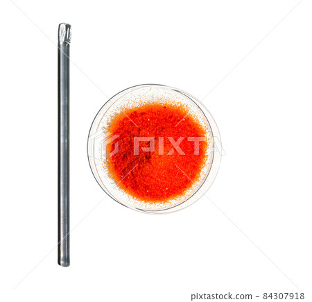 Potassium Ferricyanide in Chemical Watch Glass place next to stirring rod (Top View). Closeup chemical ingredient on white laboratory table. Potassium Ferricyanide in Chemical Watch Glass place next to stirring rod (Top View). Closeup chemical ingredient on white laboratory table. 84307918
