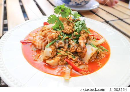 stir-fried seafood in curry powder, stir fried squid in yellow curry or Stir-fried squid and Stir-fried shrimp 84308264