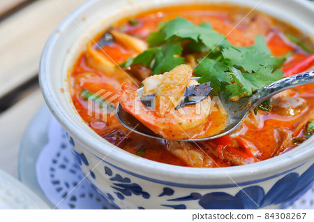 spicy soup or tom yum kung, spicy shrimp soup or seafood soup 84308267