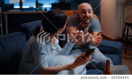 Helpless, frustrated, confused, desperate couple reading eviction notice Helpless, frustrated, confused, desperate couple reading eviction notice 84308443