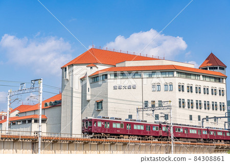Takarazuka City, Hyogo Prefecture, Takarazuka Grand Theater and Hankyu Railway on a sunny day 84308861