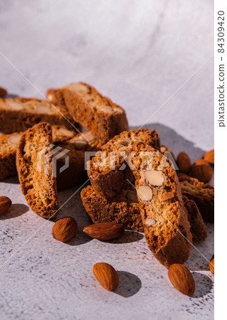 Homemade fresh Italian cookies cantuccini stacks and organic almond seeds. Biscotti Cantuccini Cookie Biscuits with Almonds Shortbread. Healthy eating food. Vegan dieting vegetarian Homemade fresh Italian cookies cantuccini stacks and organic almond seeds. Biscotti Cantuccini Cookie Biscuits with Almonds Shortbread. Healthy eating food. Vegan dieting vegetarian 84309420