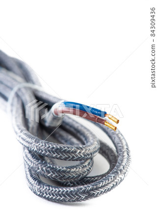 Textile fabric braid electrical cord isolated on white background Textile fabric braid electrical cord isolated on white background 84309436