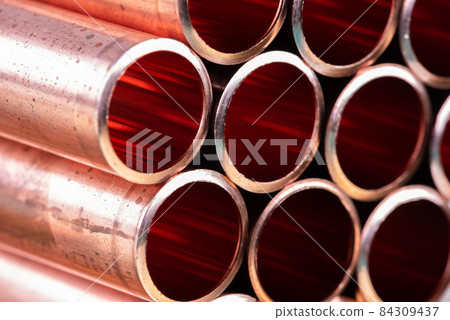 Metallurgical industry copper pipes close up  84309437