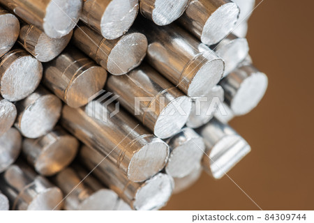Aluminum rod cross-section closeup 84309744