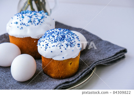 Easter eggs. Happy Day Bright Easter. Orthodox Easter holiday. Traditional food. Creative stylish trend Homemade easter cake. Selective focus 84309822