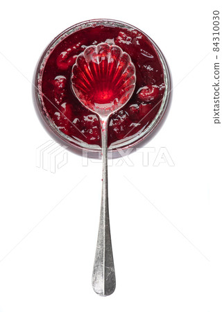 Sweet cherry confiture with spoon isolated on white background Sweet cherry confiture with spoon isolated on white background 84310030