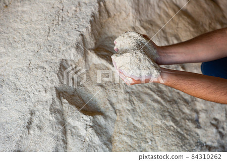 Closeup of handful of soy flour in male hands Closeup of handful of soy flour in male hands 84310262