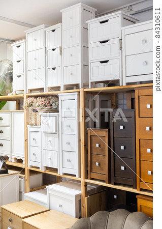 Wooden chests of drawers in a store 84310611