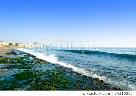 Mediterranean sea coast of the beach, stony sea and waves splashing Mediterranean sea coast of the beach, stony sea and waves splashing 84310895