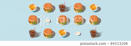 Pattern with classic cheeseburger, french fries and soda drink on orange and blue background. BBQ grill menu Pattern with classic cheeseburger, french fries and soda drink on orange and blue background. BBQ grill menu 84313206
