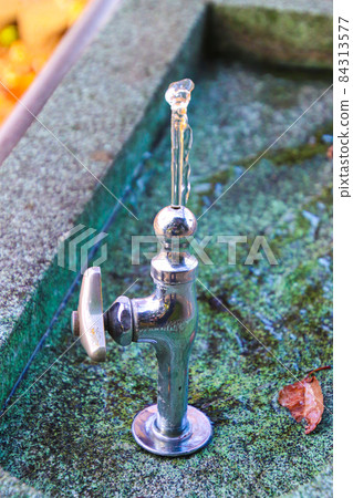 Drinking fountain in the park Drinking fountain in the park 84313577