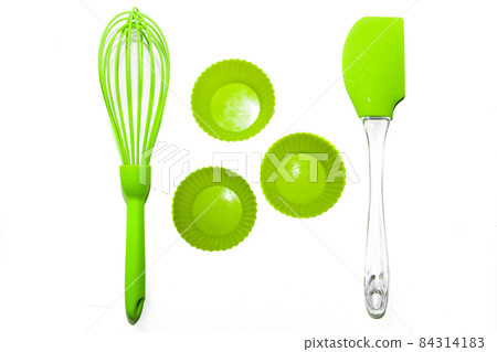 Set of green silicone cooking utensils isolated on white background Set of green silicone cooking utensils isolated on white background 84314183