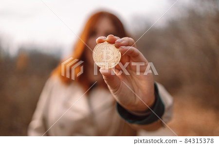 People holding and showing bitcoin. Cryptocurrency, investing in crypto assets, blockchain and altcoins 84315378